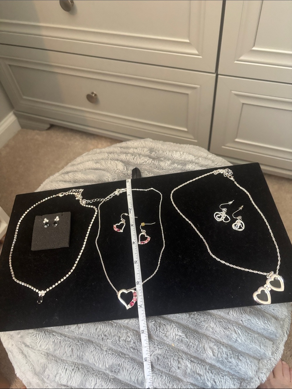 3 silvertone Pendant Necklaces matching earrings.